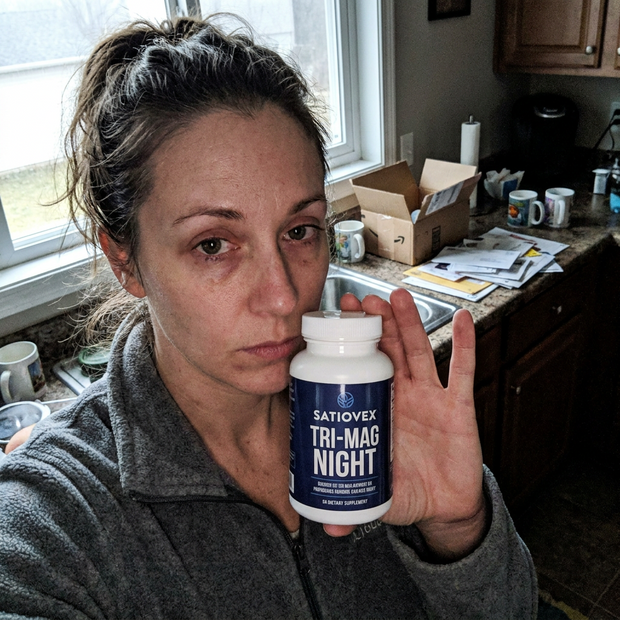 Customer holding Tri-Mag Night